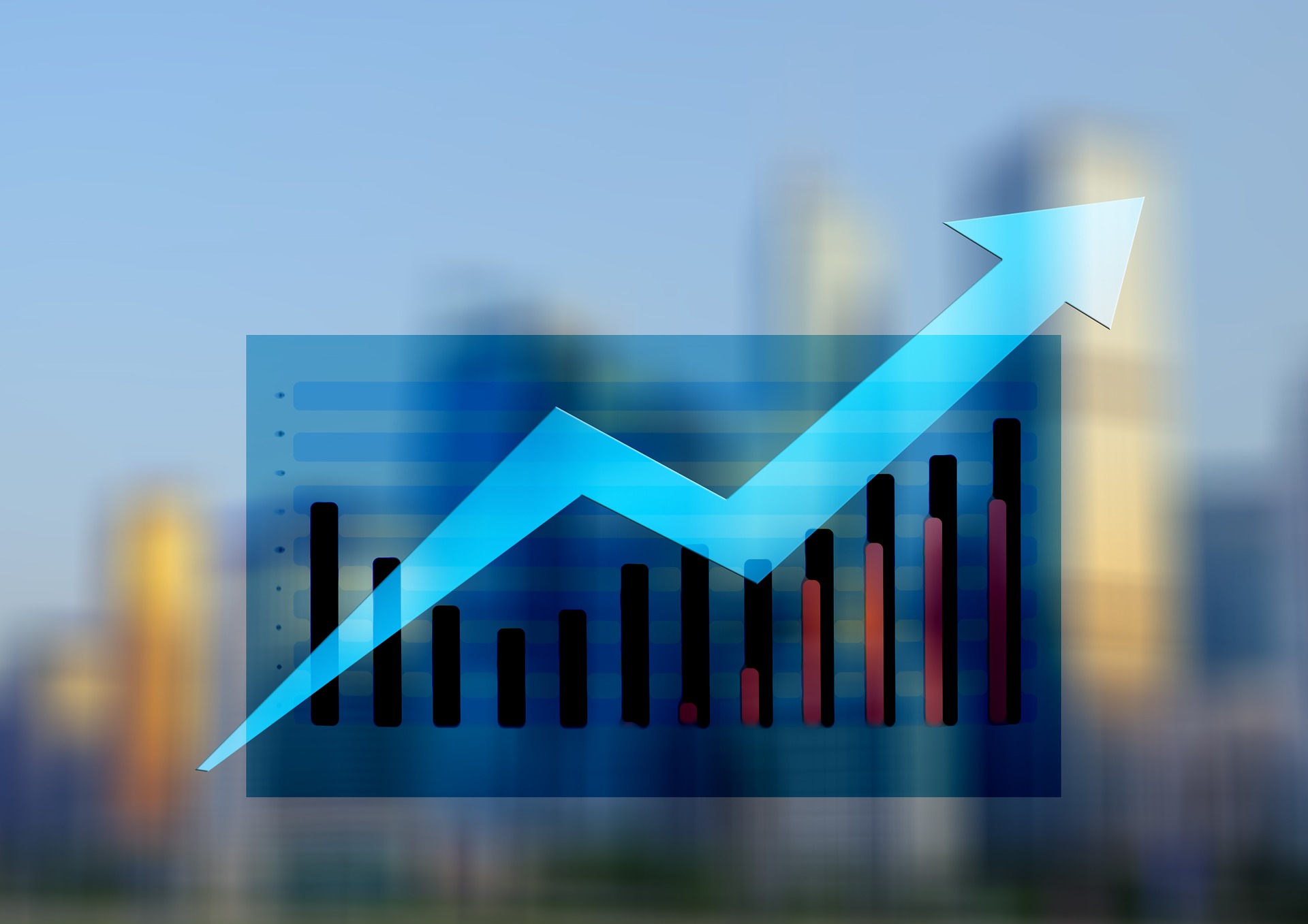 A blue upward-pointing arrow overlays a bar graph with black and red bars, symbolizing financial growth or progress, set against a blurred cityscape background.