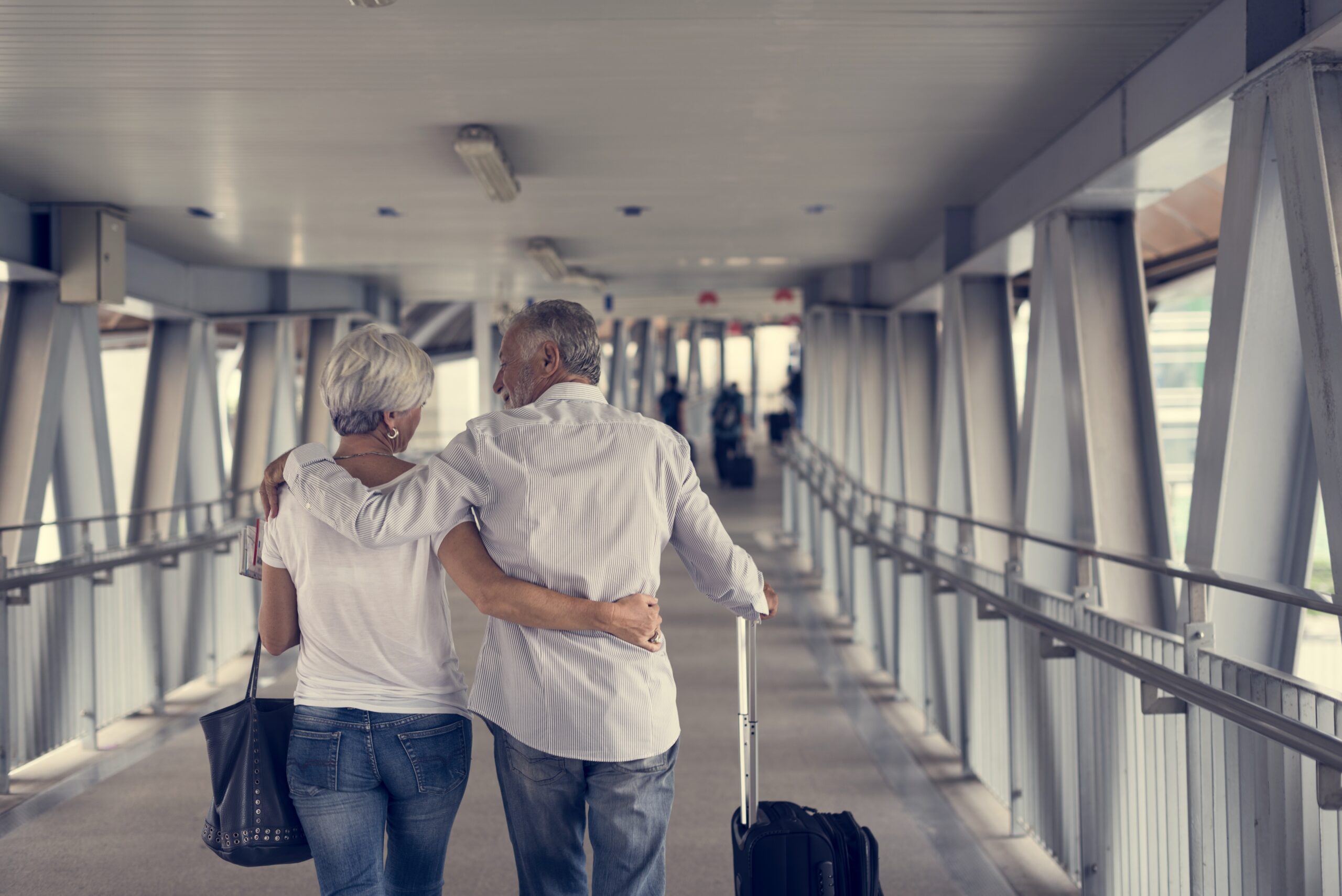 Retired couple traveling during Medicare Open Enrollment