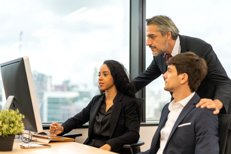 Experienced business owner working with colleagues in an office